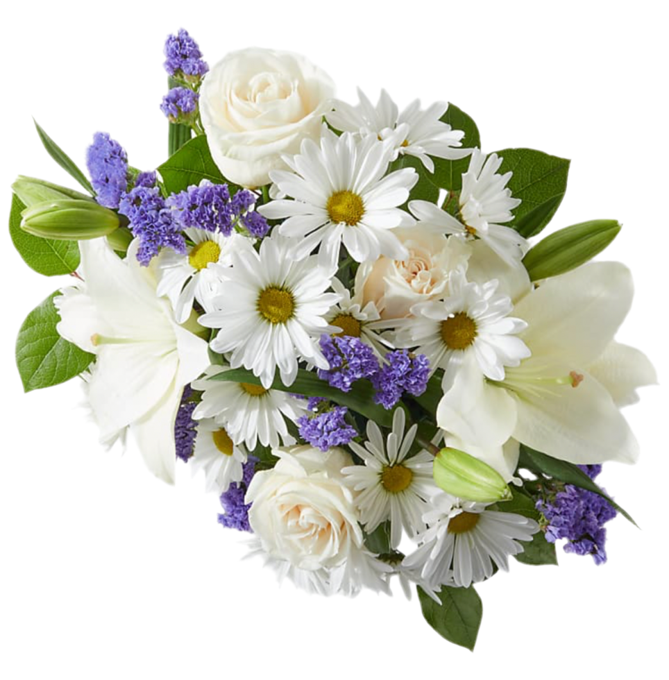 A floral arrangement in a box featuring white daisies, roses, and lilies with purple accents.