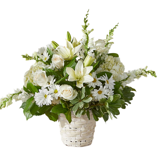 A floral arrangement featuring a variety of green and white flowers with green foliage, arranged in a basket. 