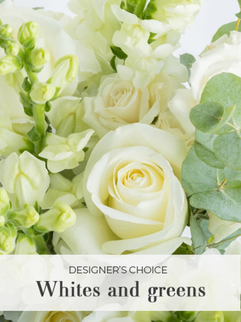 A bouquet of white flowers and green foliage, with a label that reads 'Designer's Choice'.