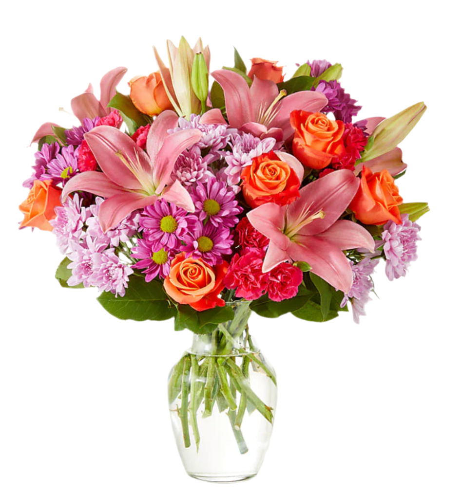 A bouquet of various flowers including pink lilies, purple daisies, orange chrysanthemums, and pink roses arranged in a clear glass vase.