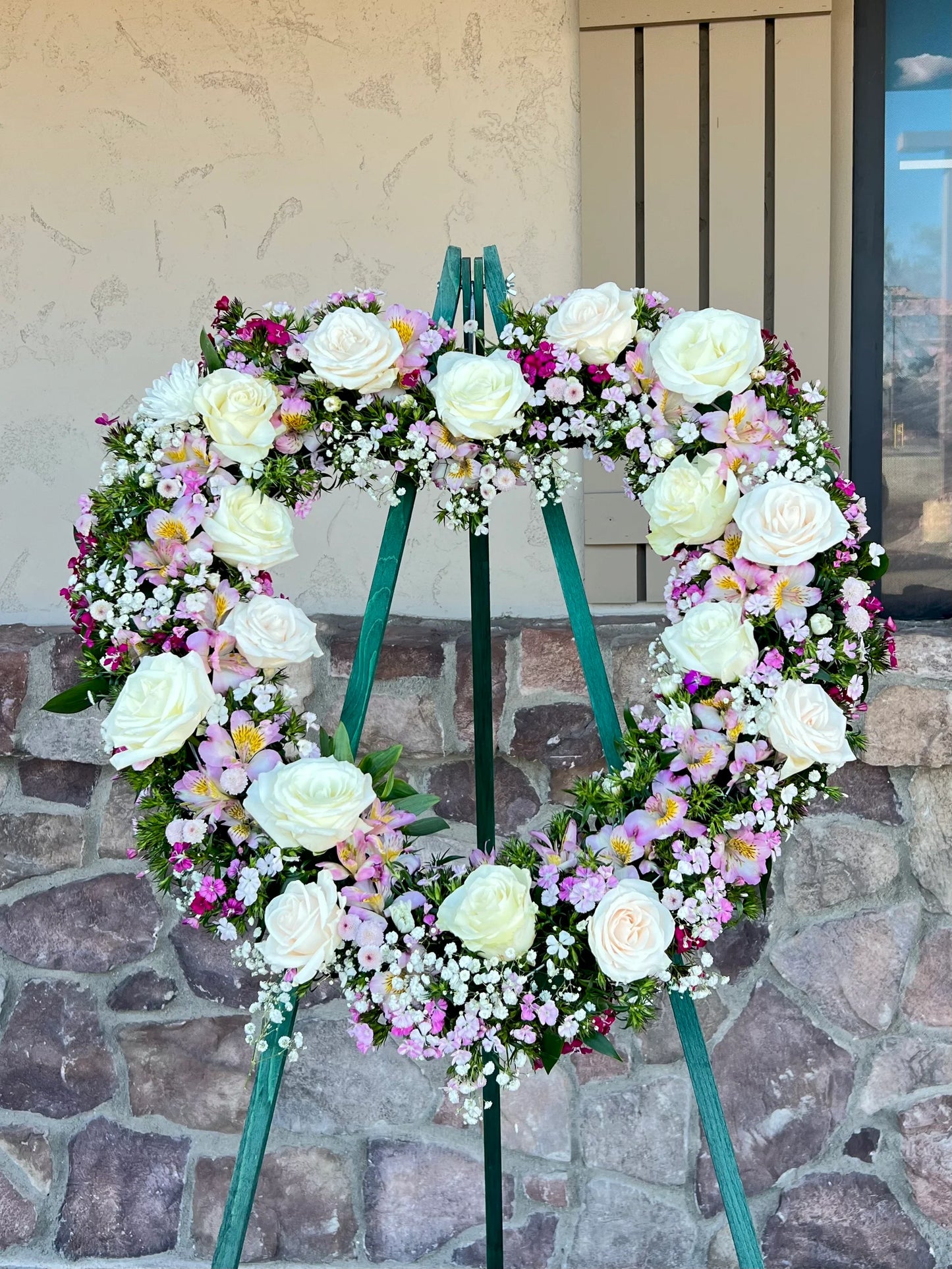 Adorned with an array of spring blooms in shades of pink, yellow, purple, and blue, this arrangement exudes the essence of renewal and vitality.